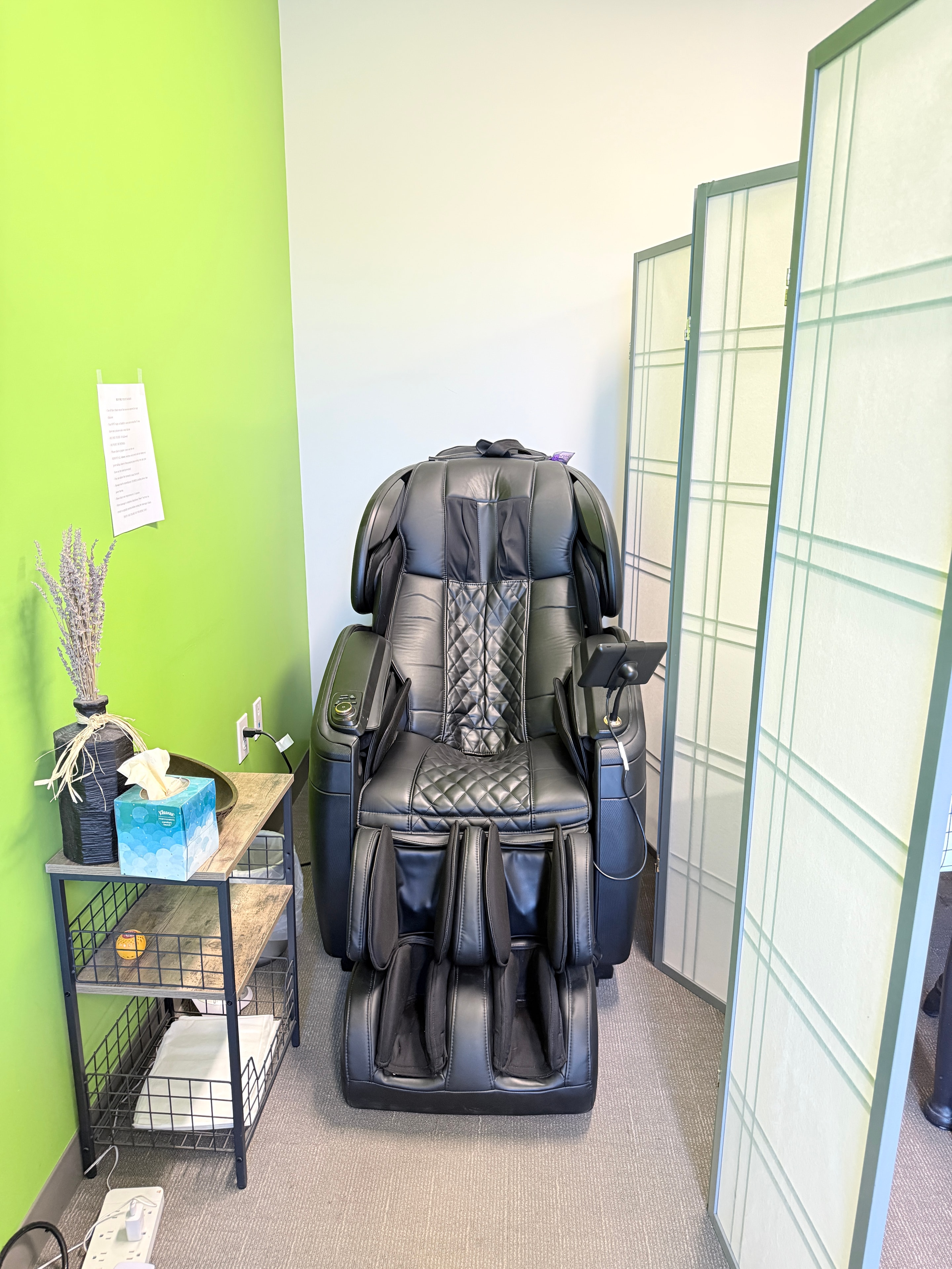 Room with a full-body massage chair for relaxation and decompression